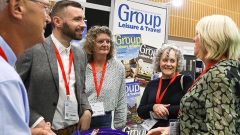 Visitors and exhibitors chat at the Group Leisure & Travel Show 2023 in Milton Keynes