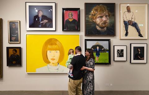 A family explore The National Lottery Heritage Fund Gallery at the National Portrait Gallery, London.