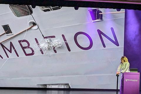 British sailor Shirley Robertson, OBE, Ambition's godmother, pushes the button for the traditional bottle smashing.