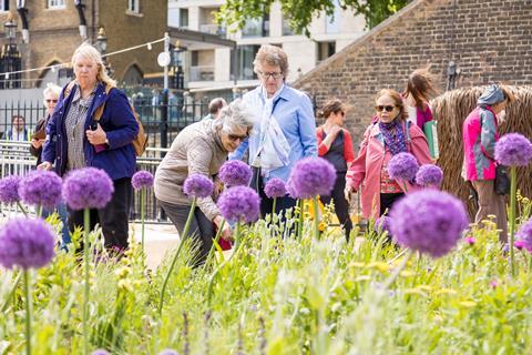 Visitors admiring the Moat in Bloom display at the Tower of London
