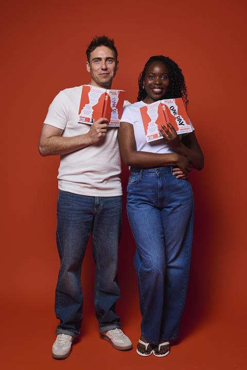Jamie Muscato and Sharon Rose pose with copies of One Day by David Nicholls