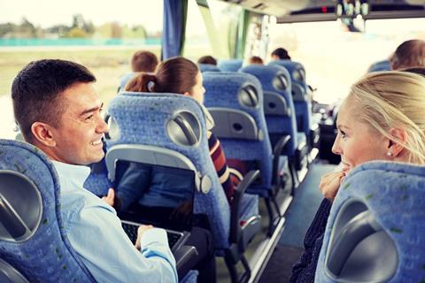 Passengers talking on a coach trip