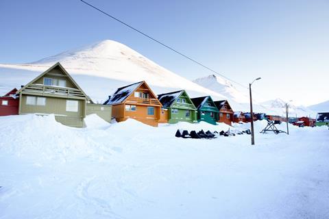 Houses surrounded by snow in Longyearbyen, Norway