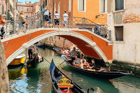 Gondolas on busy canals in Venice