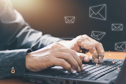 Man using laptop to check emails