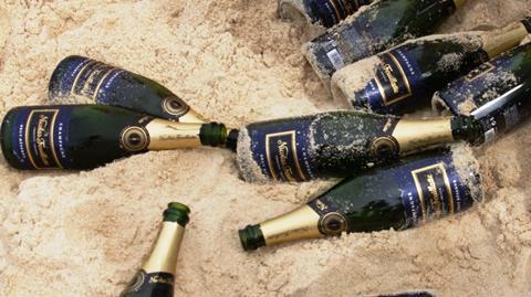 bottles of champagne on the beach