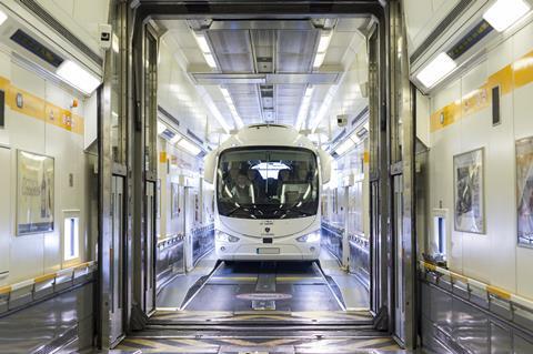 A coach boards LeShuttle