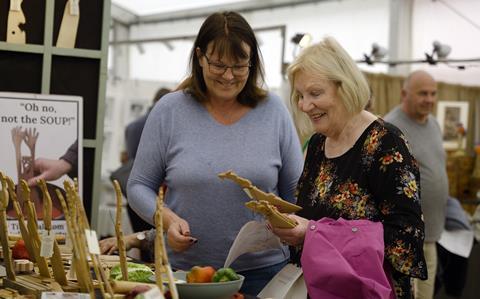 Visitors look at some of the items for sale at the Living Crafts festival in Hertfordshire