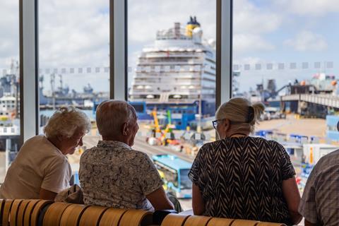 Passengers enjoying the view in the cruise lounge at Portsmouth International Port.