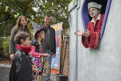 Children and their parents explore spooky displays as part of Legoland's Brick or Treat event