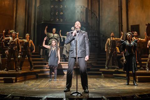 Zachary James and the company in Hadestown