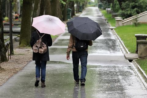 Tourists walking in the rain