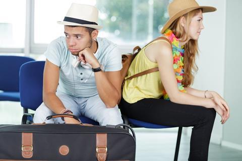 Couple after an argument at the airport