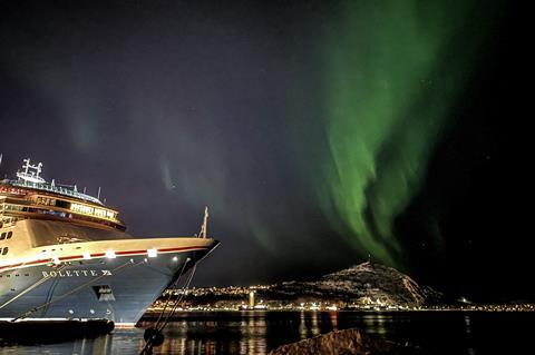 Fred. Olsen Cruise Lines' cruise ship Bolette in Alta, Norway, with the Northern Lights behind
