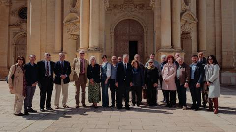 The Kings Cliffe Old Blokes Club group and locals outside the church at Zabbar.