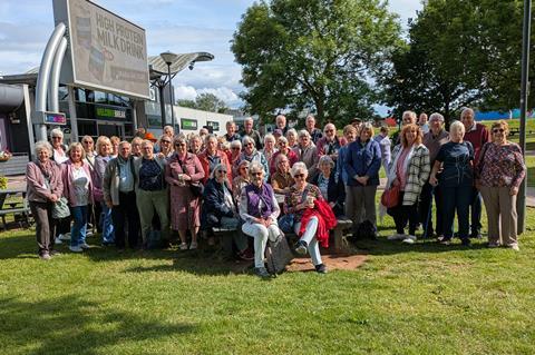 Group of people outside a service station