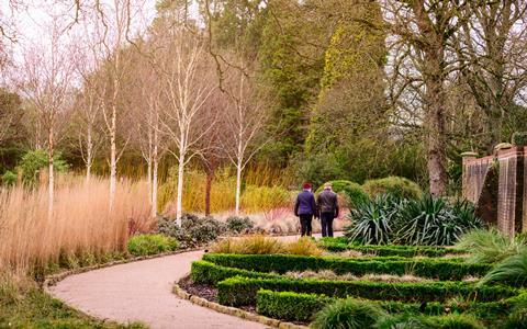 Two people exploring Wakehurst Winter Garden
