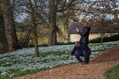 Couple taking pictures at Easton Walled Gardens