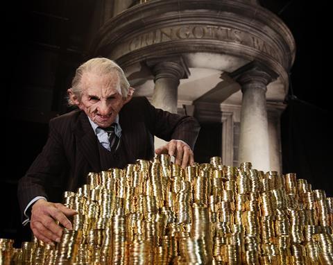 Goblin peering over a pile of gold at Warner Bros Studio London's new Gringotts Bank attraction