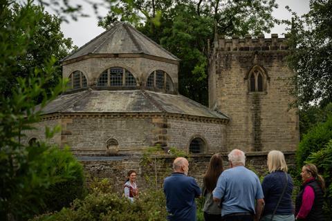 Group standing outside old church