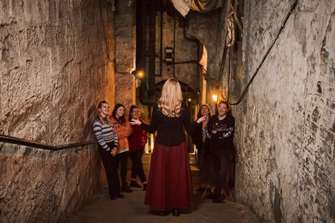 A group of tourists having a tour of The Real Mary King's Close, Edinburgh