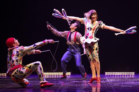 Performers juggling in the Cirque du Soleil's Corteo show