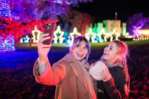 Two women taking a selfie outside Hever Castle at Christmas