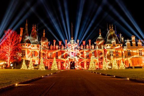 The exterior of Waddesdon Manor illuminated for Christmas