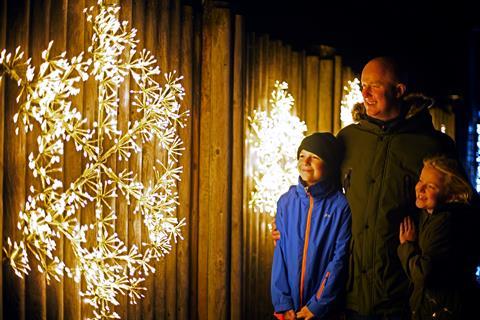 Family enjoying the light displays at Glow Marwell