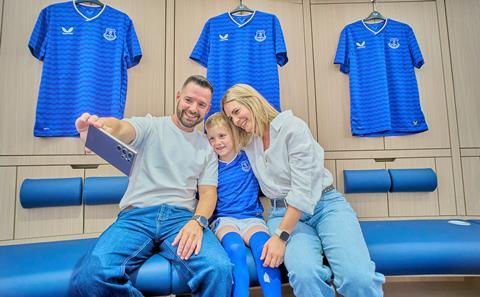 A family take a selfie during an Everton Football Club Stadium Tour