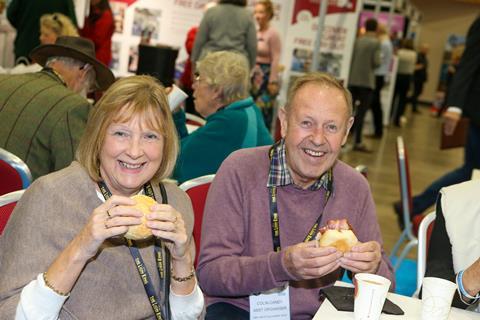 Visitors enjoying a bacon roll at GLT Show 2019