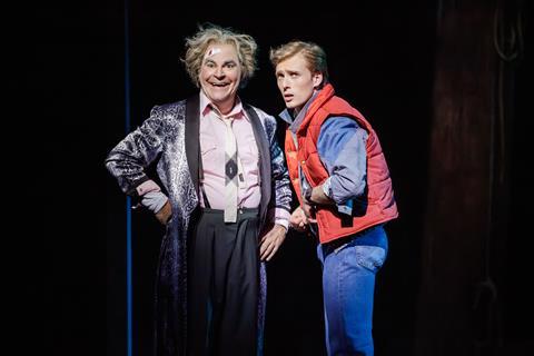 Roger Bart (as Doc Brown) and Axel Duffy (as Marty McFly)