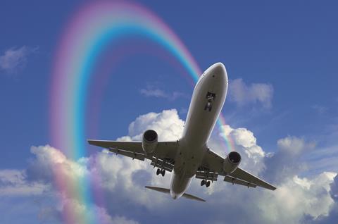 Aeroplane in the sky with rainbow