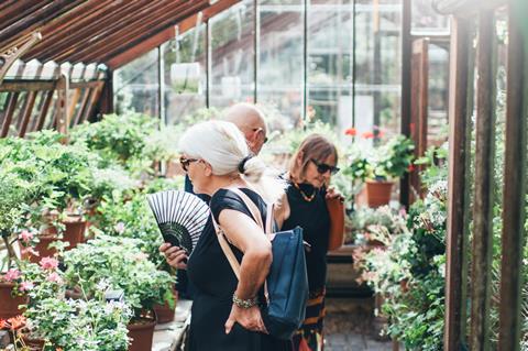 Visitors explore the newly opened glasshouses at Chelsea Physic Garden in London.