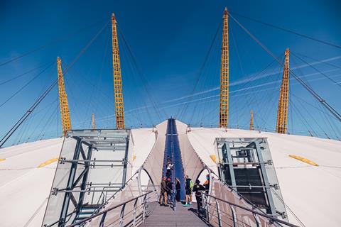 A group climbing on the roof at Up at The O2