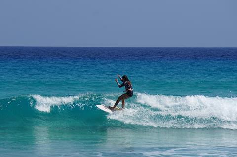 Woman surfing in the Canary Islands, Spain