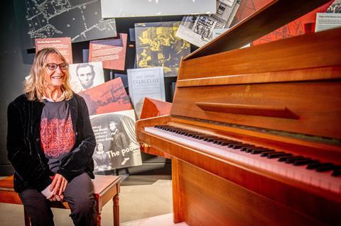 John Lennon's sister Julie Baird with the Imagine piano 