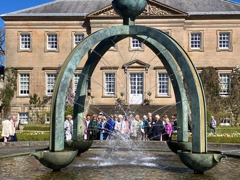 A group outside Dumfries House in Scotland.