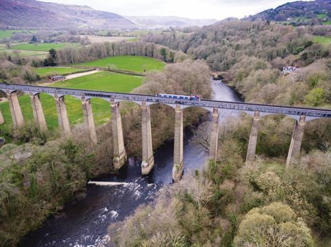 A narrowboat goes over the Pontcysyllte Aqueduct in Wales