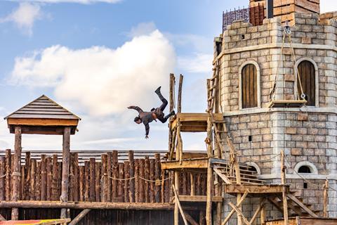 Man jumping off tower