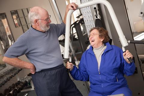 Senior Adult Couple Working Out in the Gym