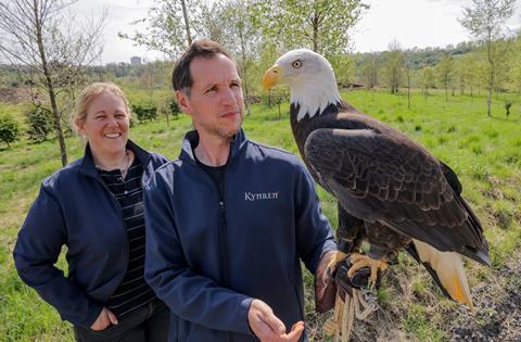 Anna Warnecke, CEO of Kynren, meets Sam, a bald eagle that will be a part of the Lost Feather
