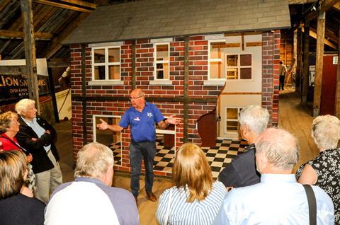 Cheshire's Lion Salt Works Museum, tour group in front of the museum's 'subsiding house'