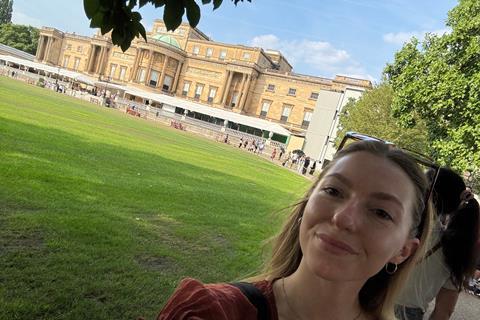 Woman outside Buckingham Palace