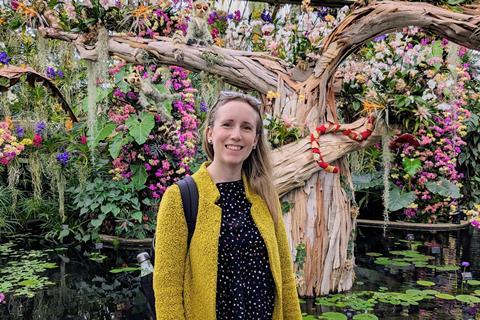 Keeley Rodgers at Kew's Orchid Festival standing in front of one of the displays