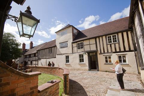 A visitor in the courtyard of The Commandery, Worcester