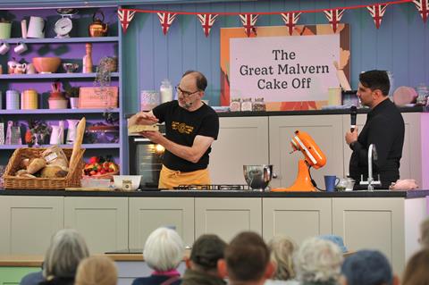 Man doing baking demonstration in front of audience