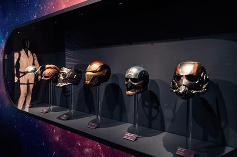 Superhero masks from Marvel Movies, including Iron Man, on display at Disney100: The Exhibition in London
