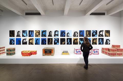 Visitor looking at prints in the Andy Warhol Museum, Pittsburgh